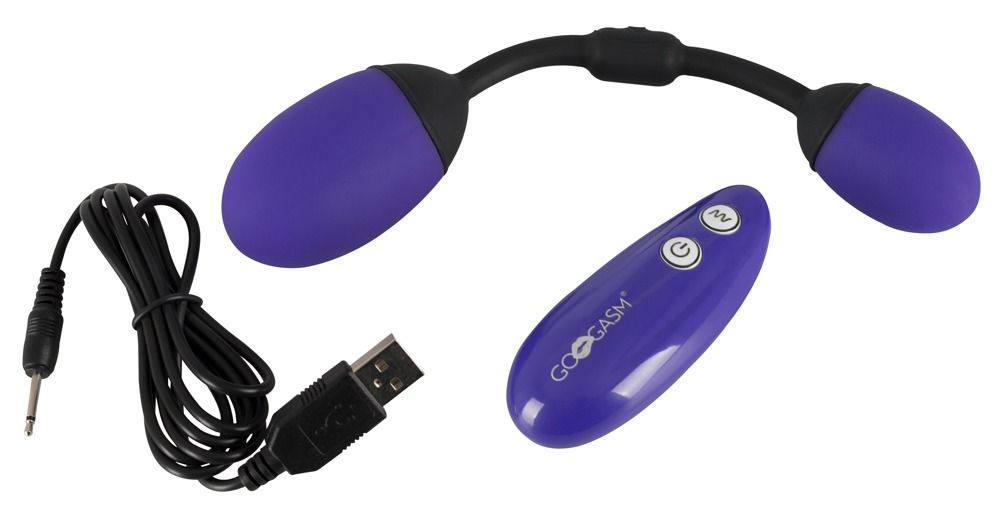 Produkt mit zwei lila Eiern, schwarzem Stiel, Fernbedienung und USB-Kabel.