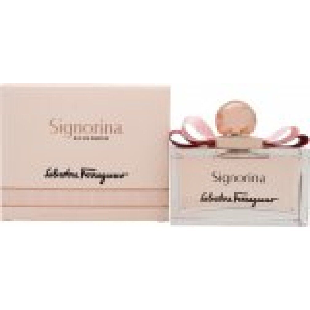 Parfümflakon mit rosa Flüssigkeit, Schleife und goldfarbenem Verschluss. Signorina, Salvatore Ferragamo. Rosa Verpackung daneben.