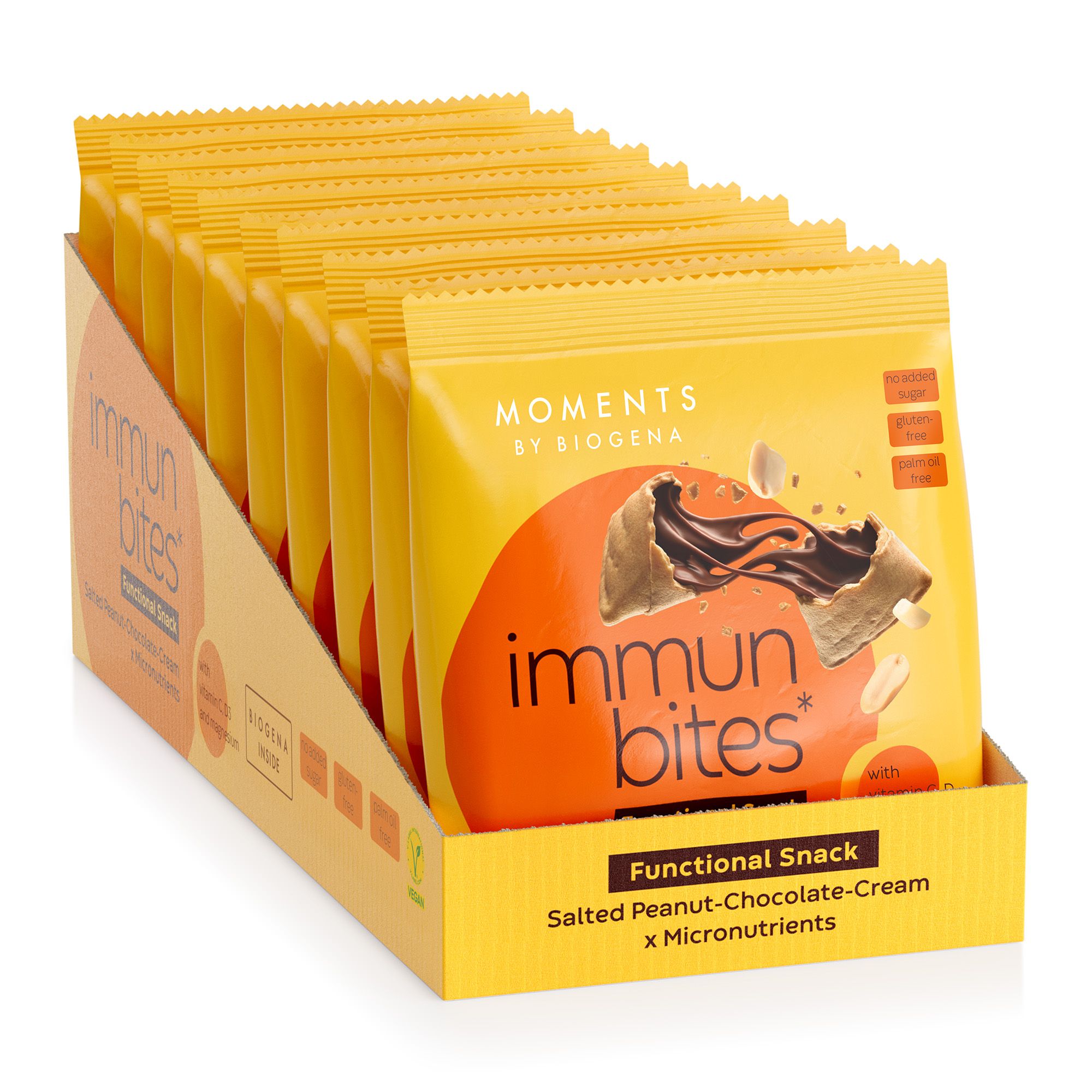 Verpackung "Moments by BIOGENA immun bites" in einem Karton. Mehrere gelbe Snack-Verpackungen. Vegan-Siegel. Text: "Functional Snack".