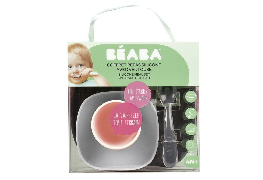 BEABA-Geschirr-Set in Verpackung. Enthält Teller, Schüssel, Löffel. Transparente Verpackung mit Produktinformationen.