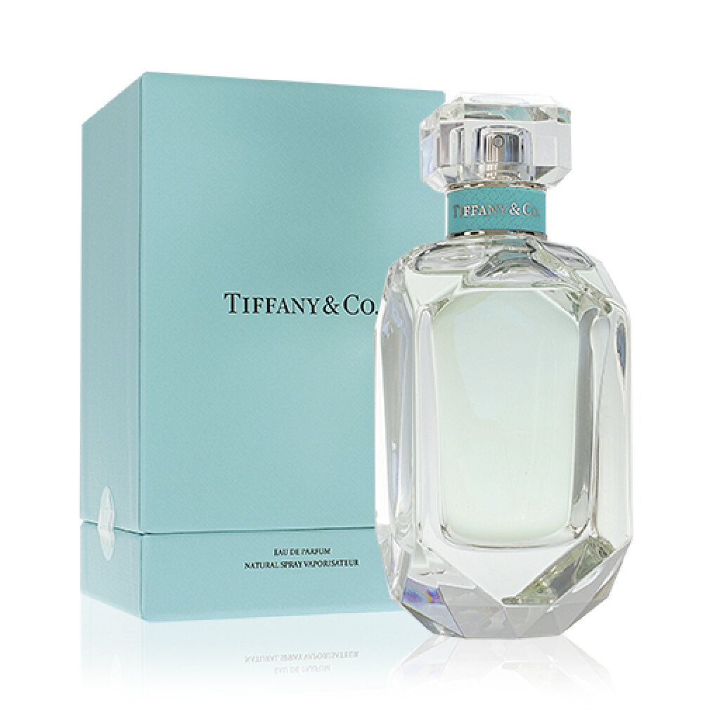 Tiffany & Co. Eau de Parfum Flakon und Schachtel. Türkisfarbene Schachtel mit Logo. Klarer Flakon mit Deckel.