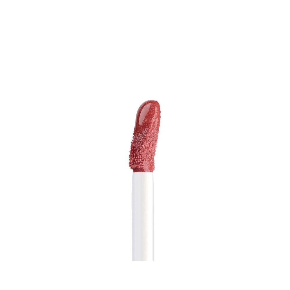 Applikator mit Artdeco Plumping Lip Fluid 028 Goddess. Rosa Flüssigkeit auf der Spitze.