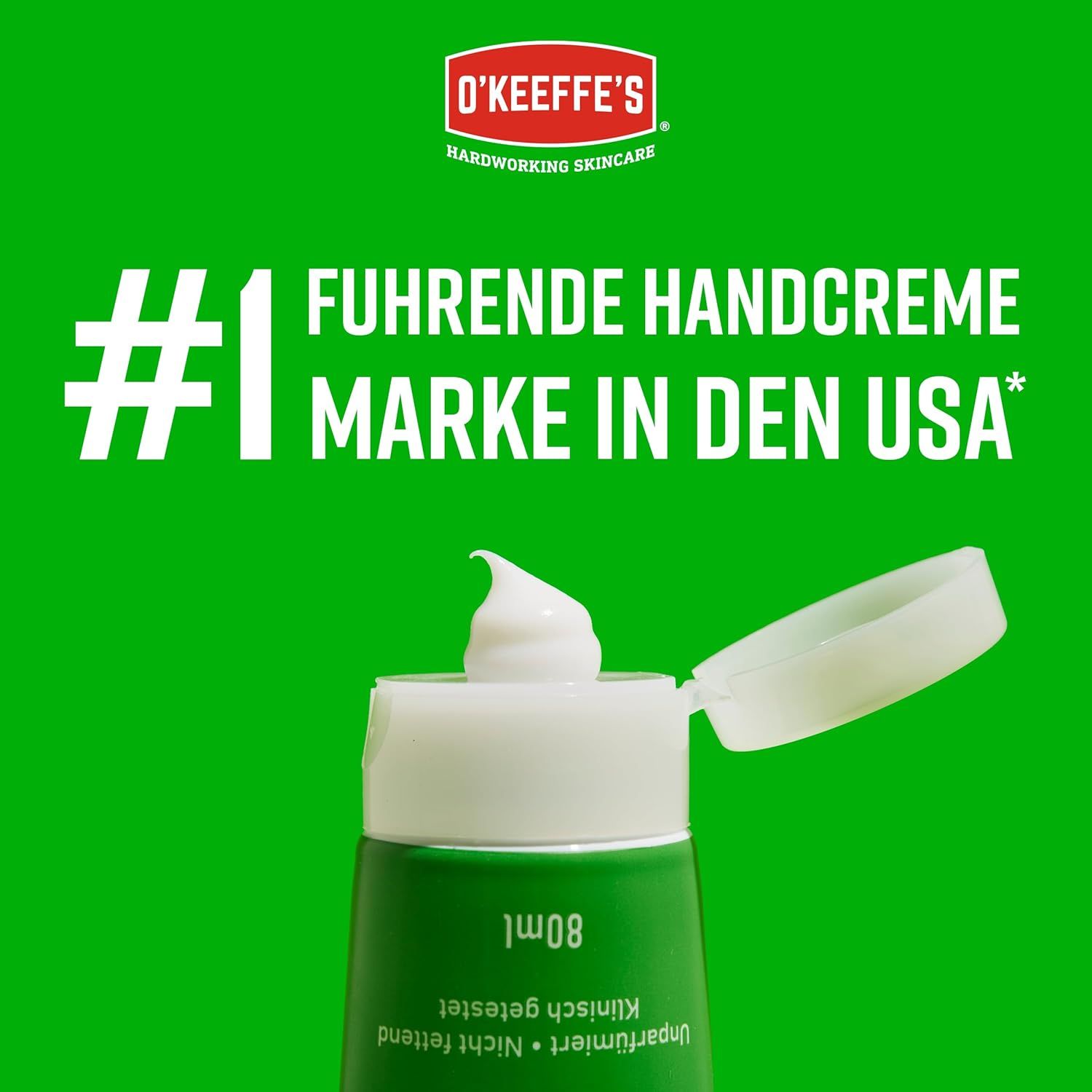 Geöffnete Tube O'Keeffe's Working Hands. Creme tritt aus. Text: Nr. 1 führende Handcreme Marke in den USA. 80ml.