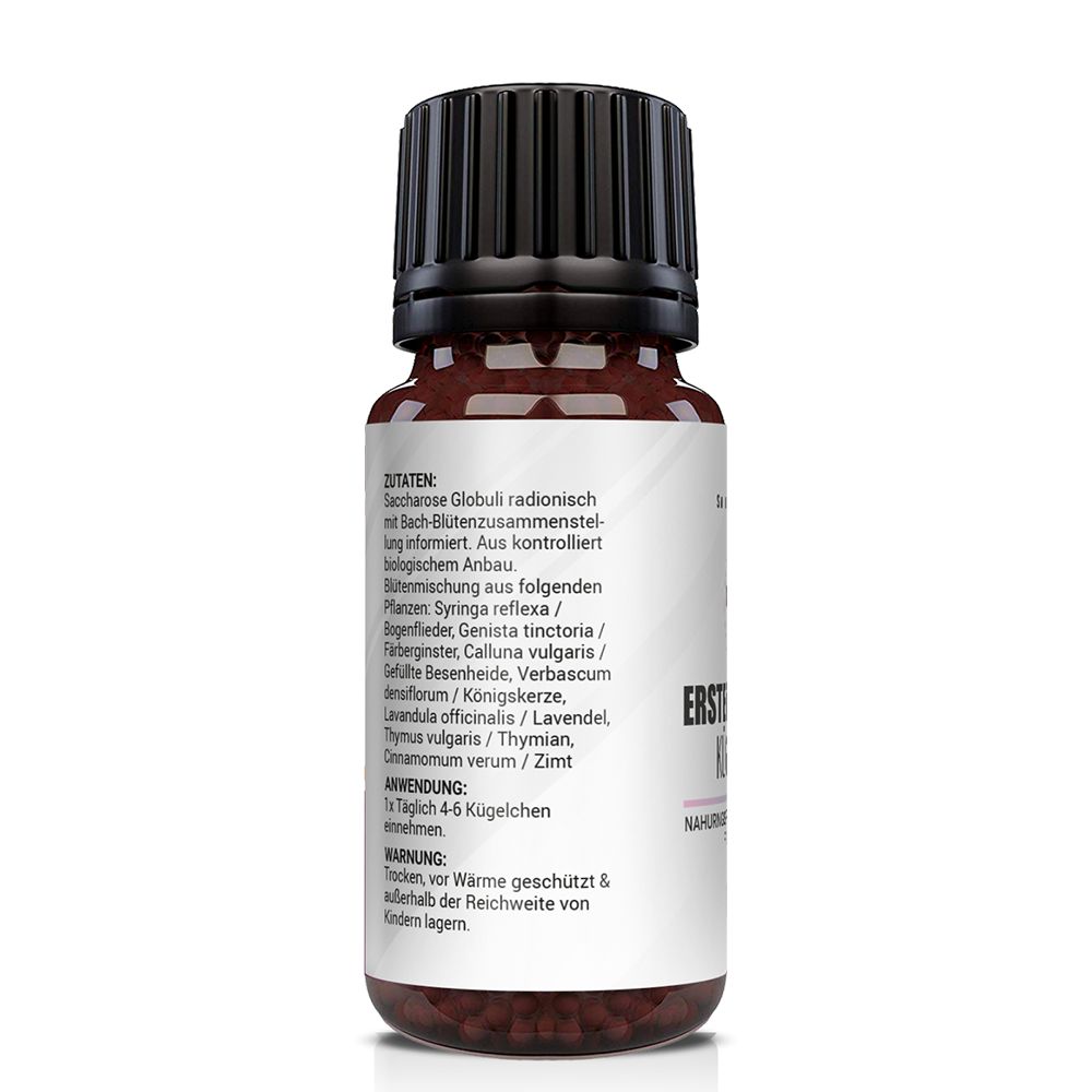 Rückseite der braunen Glasflasche. Text mit Inhaltsstoffen und Warnhinweisen. Marke: Saint Nutrition. Produkt: Erste Zähnchen Kügelchen.