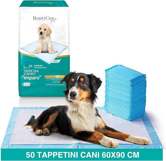 Hygienische Hundepads, Packung mit 50 Stück, 60x90 cm. Ein Hund liegt auf einem Pad, daneben ein Stapel Pads und eine Produktverpackung.