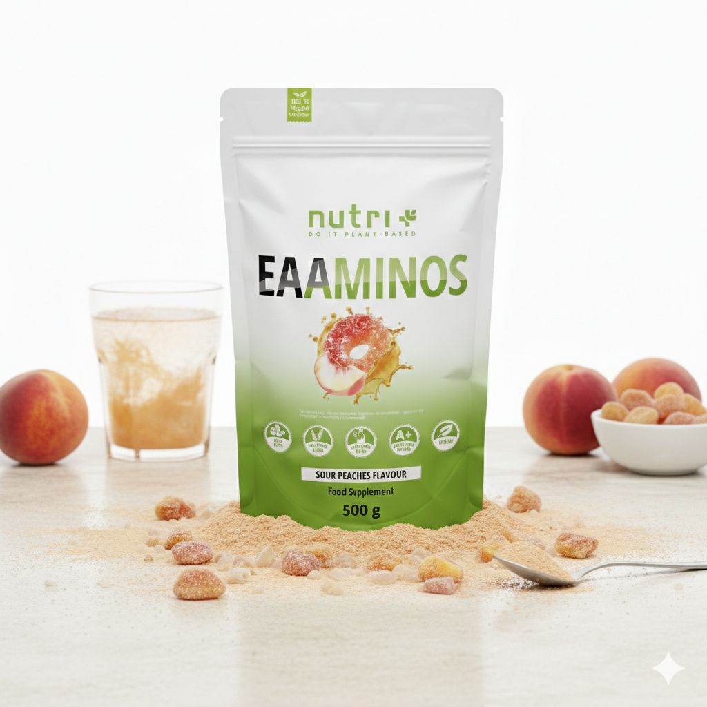 Weiße Standbodenbeutel-Verpackung mit "EAAMINOS" und Pfirsich-Design, umgeben von Pfirsichen und Pulver.