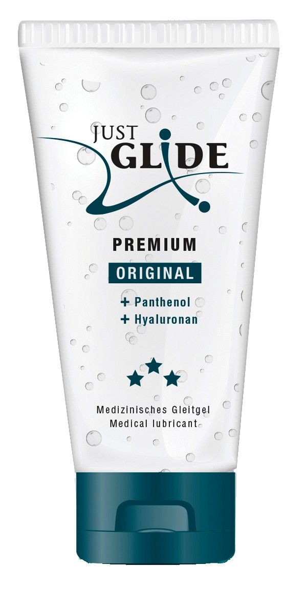 Transparente Tube mit blauem Verschluss. Aufschrift: JUST GLIDE PREMIUM ORIGINAL. Enthält Panthenol und Hyaluronan. Medizinische Gleitgel.