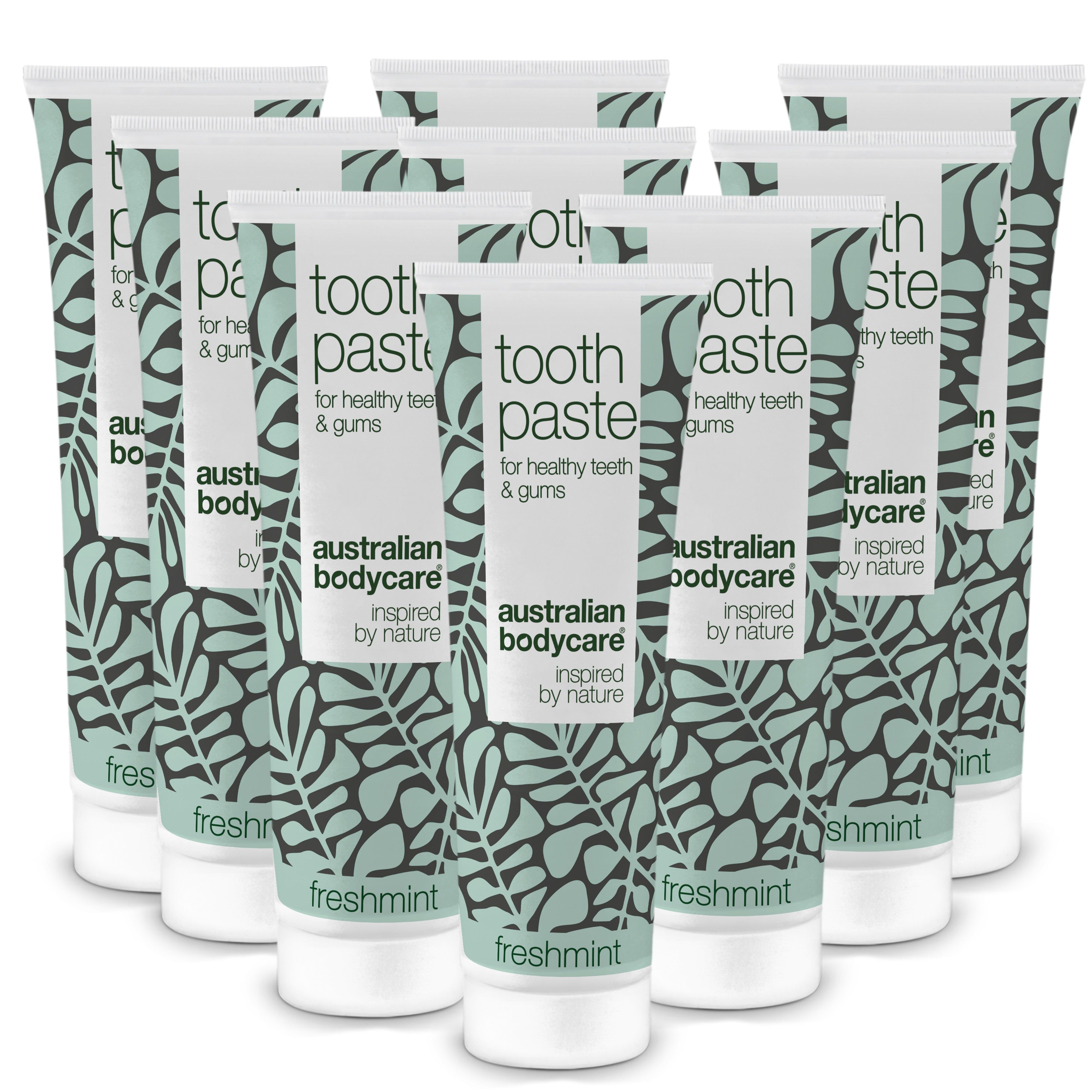 Zahnpasta-Tuben, australian bodycare, mit frischer Minze. Mehrere Tuben, weiß-grünes Design, Blättermuster.