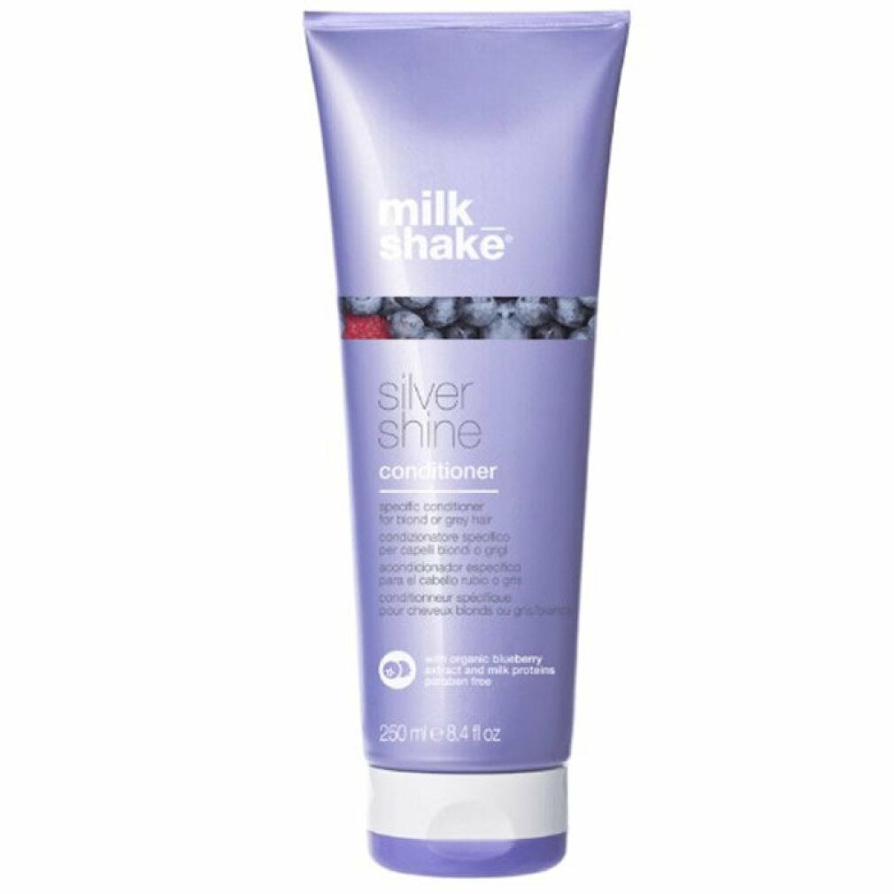 Lila Tube mit Produkt. Aufschrift: milk_shake Silver Shine Conditioner. Mit Blaubeeren-Illustration.
