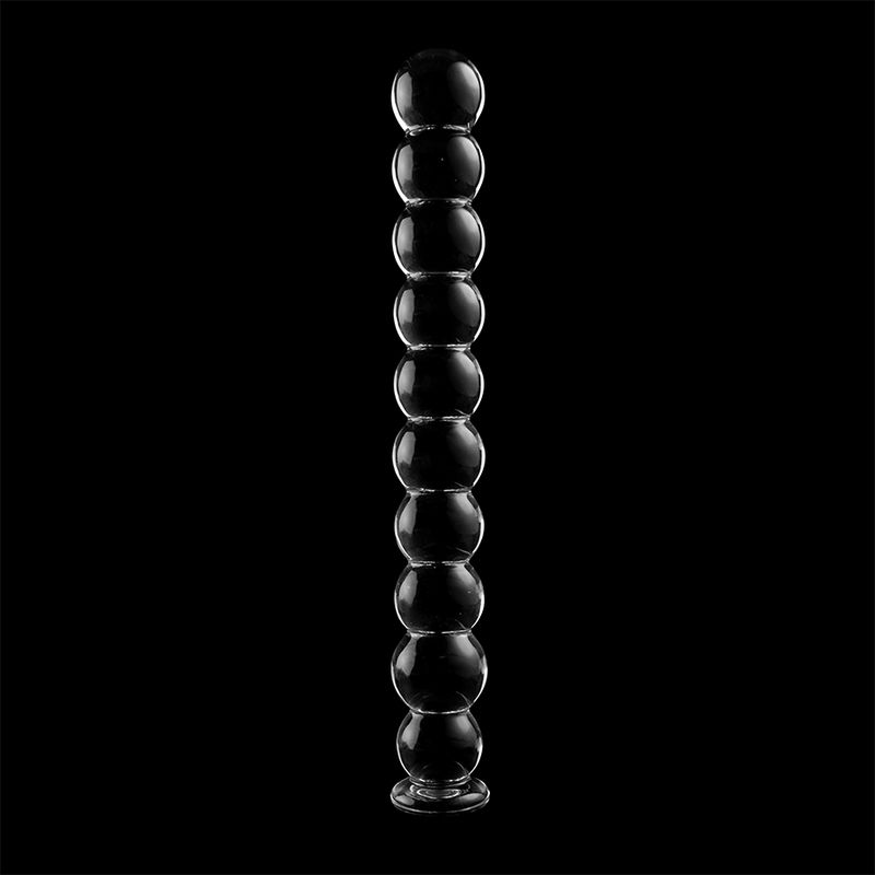Dildo aus Borosilikatglas. Klares Glas, kugelförmige Elemente. Vertikale Ausrichtung, auf schwarzem Hintergrund.