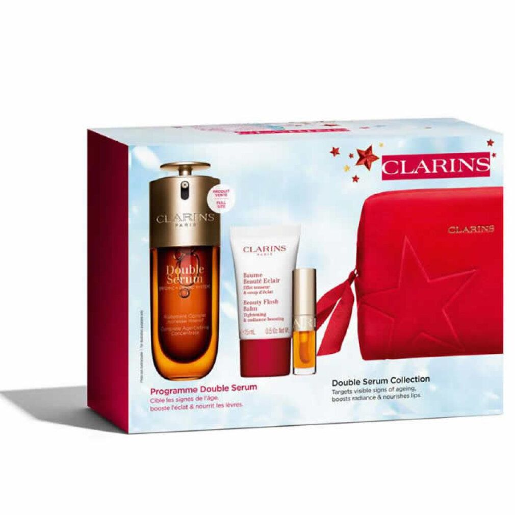 Geschenkset mit Serum, Creme, und roter Kosmetiktasche. Verpackung mit Produktnamen und Sternen. Marke Clarins.