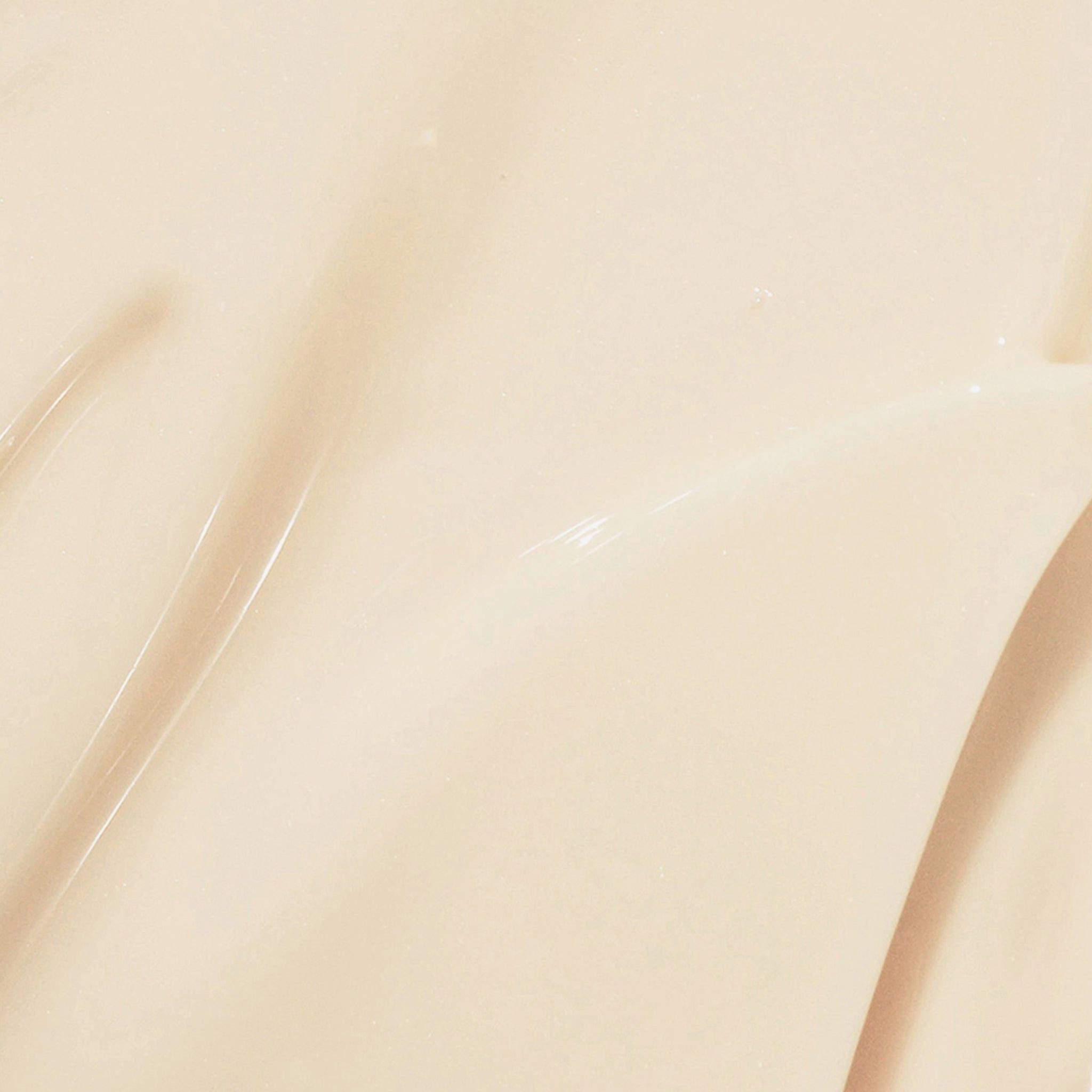 Nahaufnahme einer Creme. Cremefarbene Textur mit glänzender Oberfläche.
