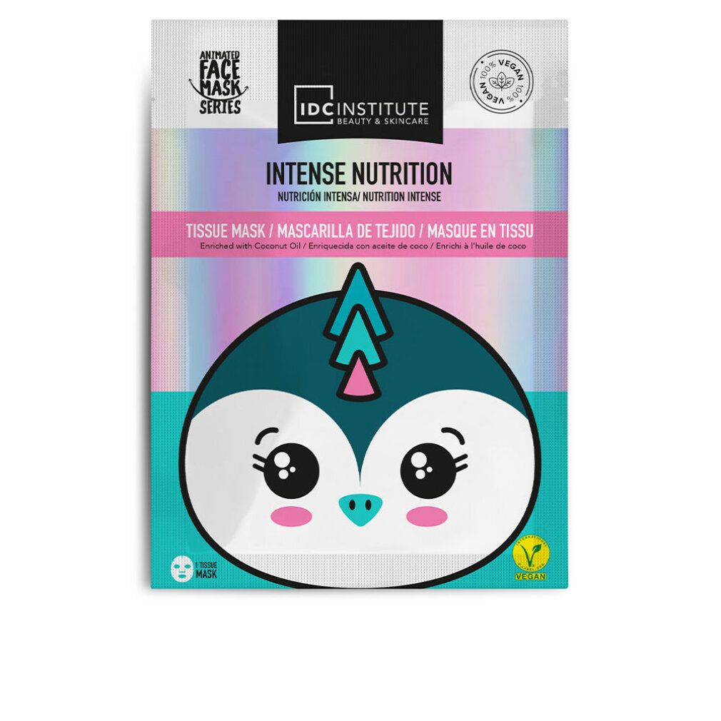 Gesichtsmaske mit Pinguin-Design. Verpackung mit Aufschrift 'Intense Nutrition' und 'Vegan'.