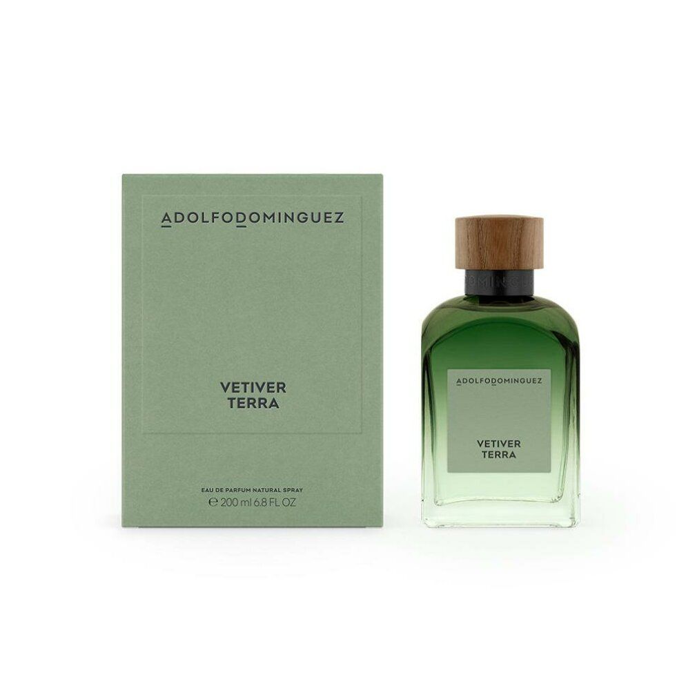 Grüne Glasflasche und Schachtel. Aufschrift: VETIVER TERRA. Marke: ADOLFODOMINGUEZ. Flasche mit Holzdeckel.