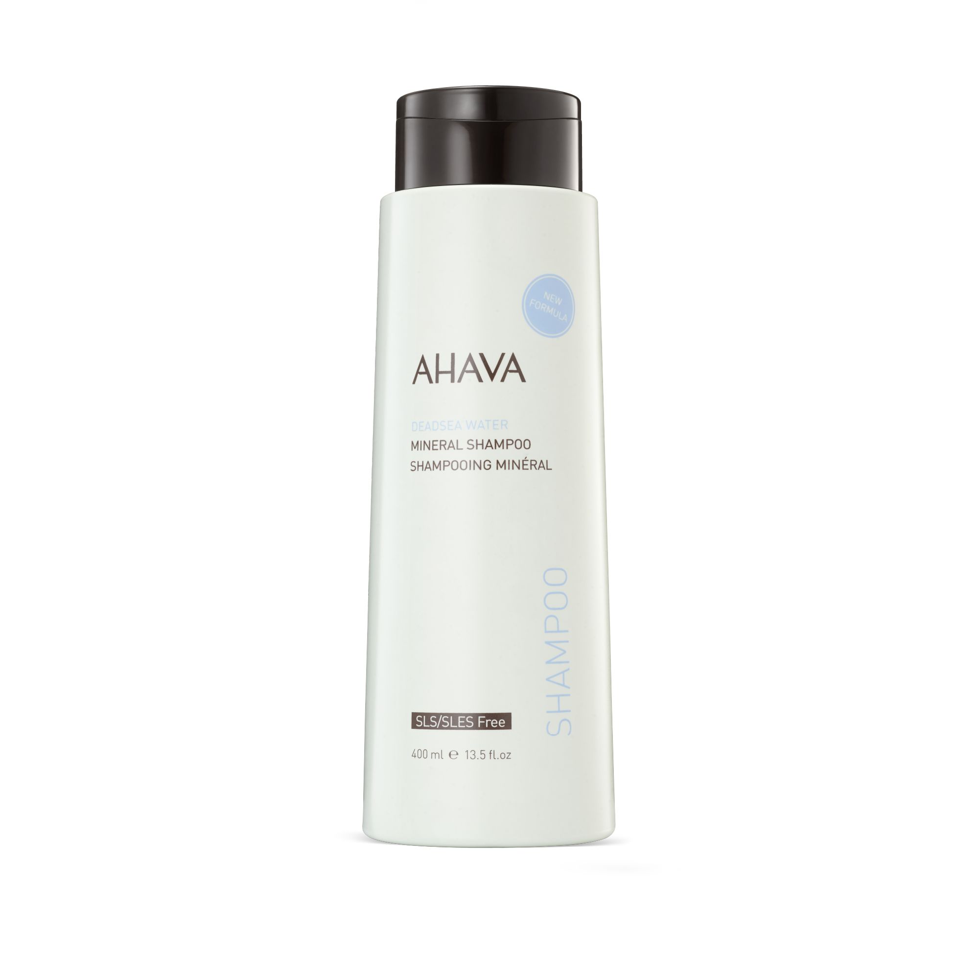 Weißes Shampoo mit schwarzem Deckel. AHAVA-Logo und Produktbezeichnung. Aufschrift: Mineral Shampoo. Volumen: 400 ml.