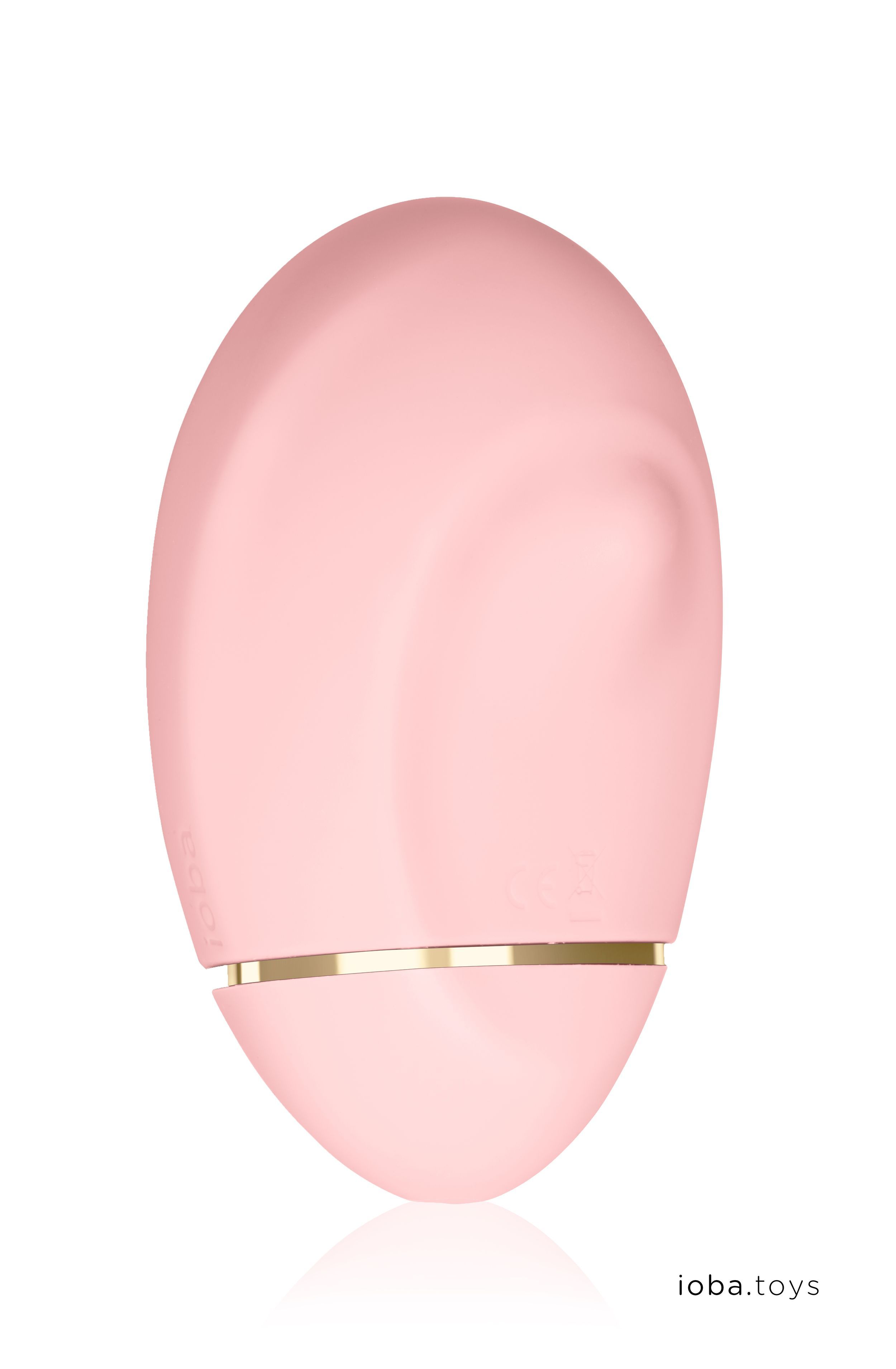 Rosa, ovales Gerät mit goldfarbenem Akzent. CE-Kennzeichnung. Text: ioba.toys.