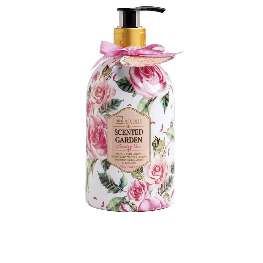 Flasche mit Rosenmuster und Dosierpumpe. Aufschrift: Scented Garden, Rose. Rosa Schleife und Anhänger.
