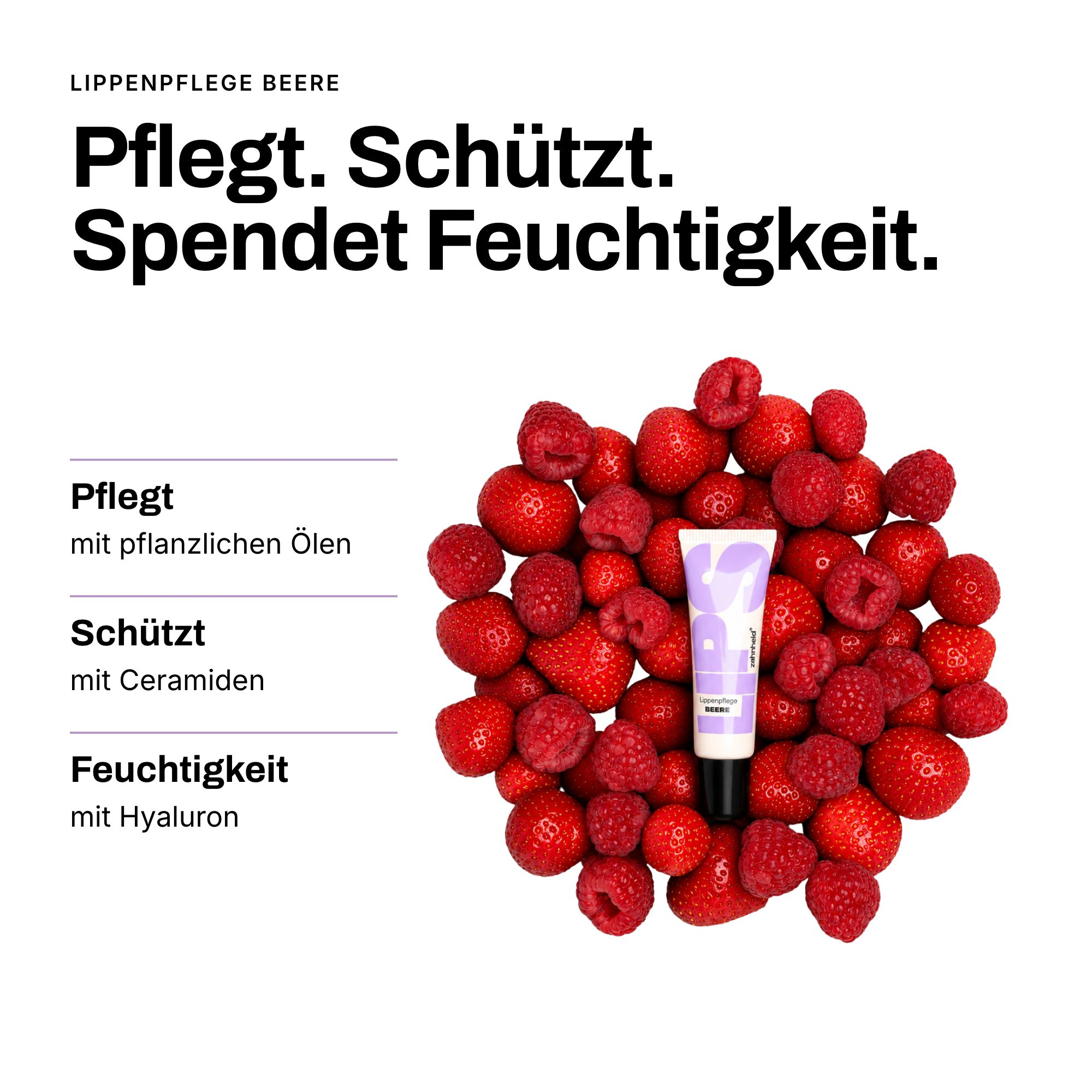Lippenpflege-Tube umgeben von frischen Erdbeeren und Himbeeren. Text: Pflegt, schützt, spendet Feuchtigkeit.
