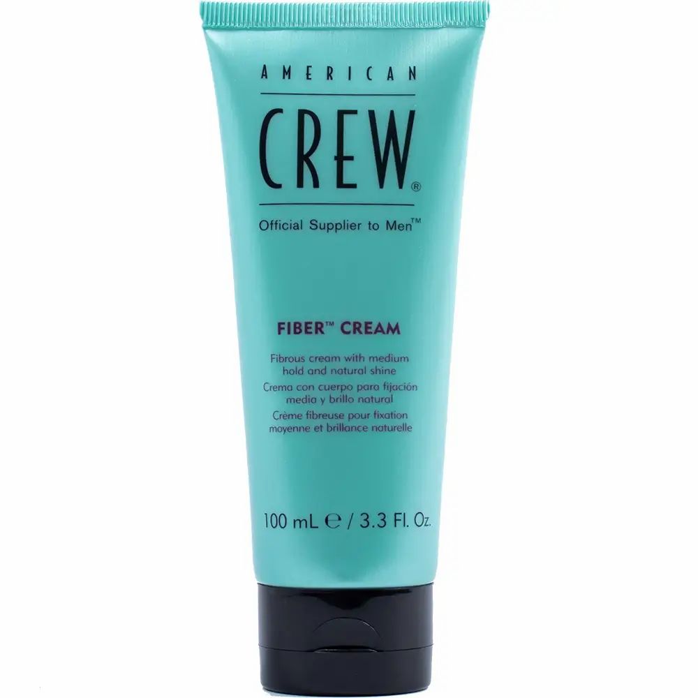 Hellblaue Tube mit schwarzem Deckel. Aufschrift: American Crew, Fiber Cream. Produkt steht auf weißem Hintergrund.