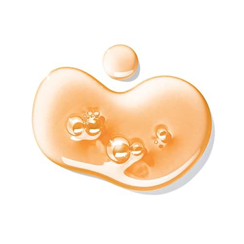 Tropfen orangefarbener Gel-Textur mit Luftblasen auf weißem Hintergrund.