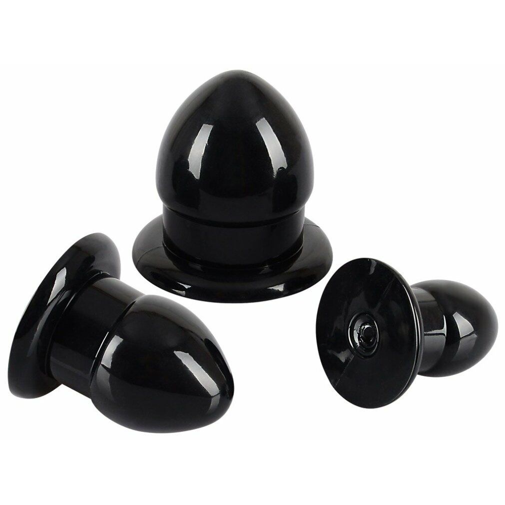 Drei schwarze Anal-Stretching-Plugs. Kegelförmig mit breiter Basis. Auf weißem Hintergrund.