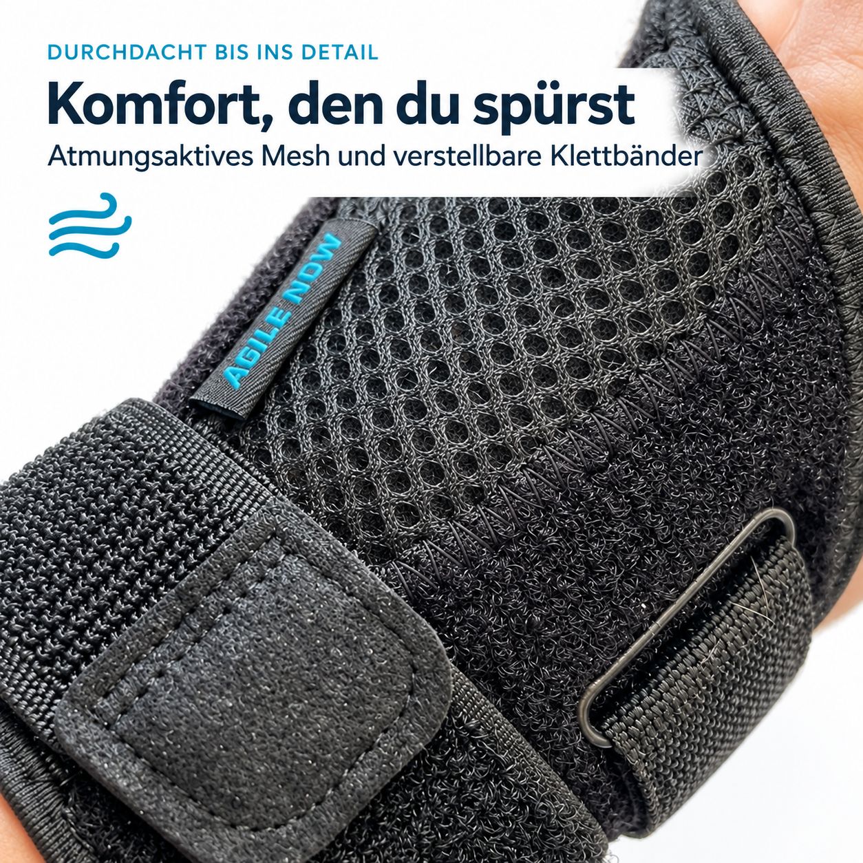 Nahaufnahme der AGILE NOW Daumenbandage: Mesh-Struktur, Klettverschlüsse, Logo "AGILE NOW".