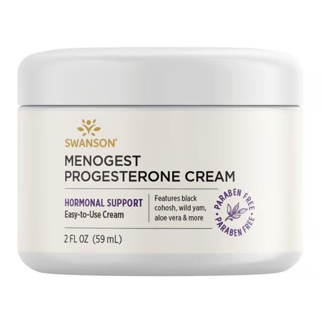 Weißer Tiegel mit Aufschrift SWANSON Menogest Progesteron-Creme. Hormonelle Unterstützung. 2 FL OZ (59 ml). Paraben-frei.