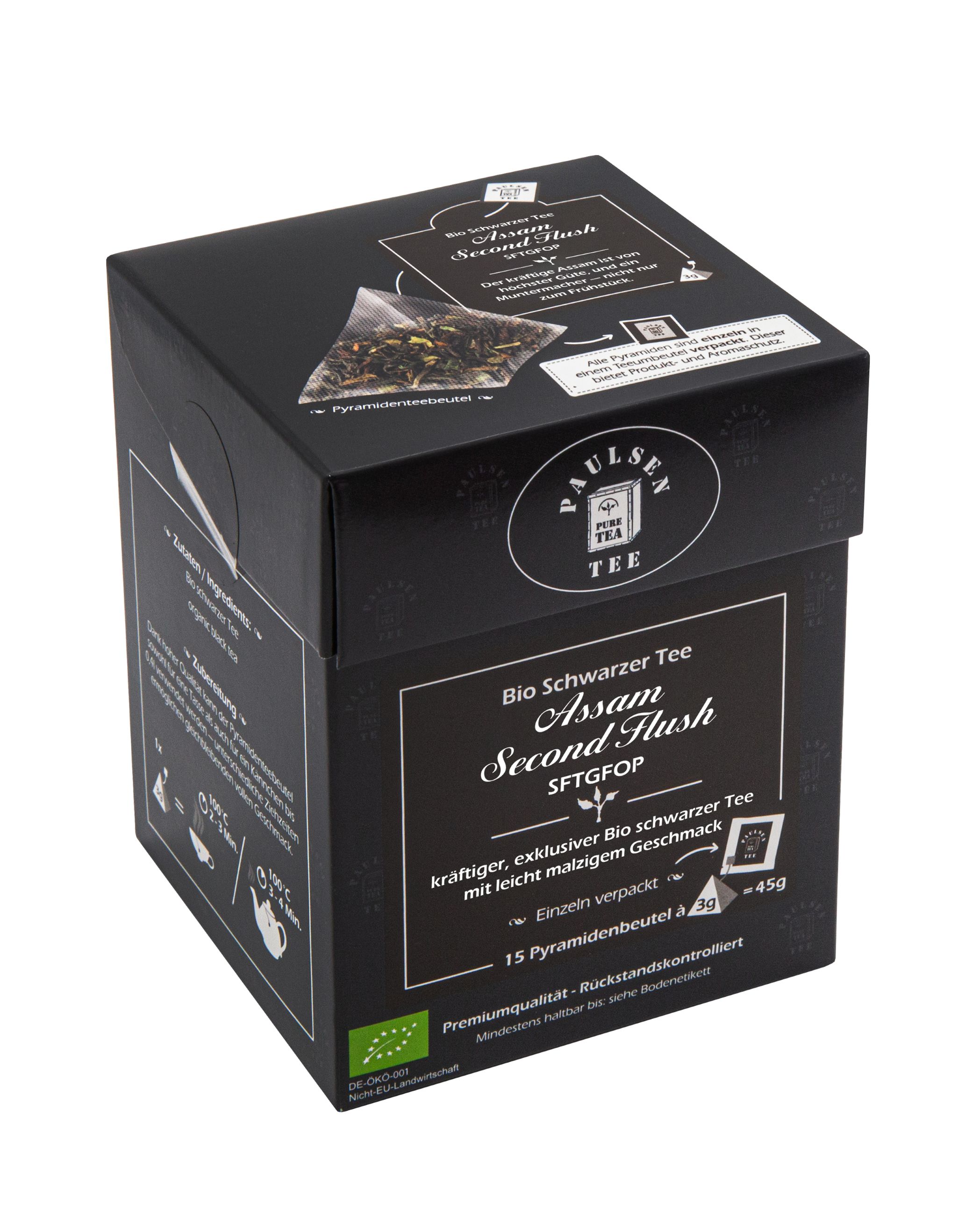Schwarze Tee-Box mit Logo und Text. Einzeln verpackte Pyramidenbeutel. Bio-Siegel. Text: Assam Second Flush.