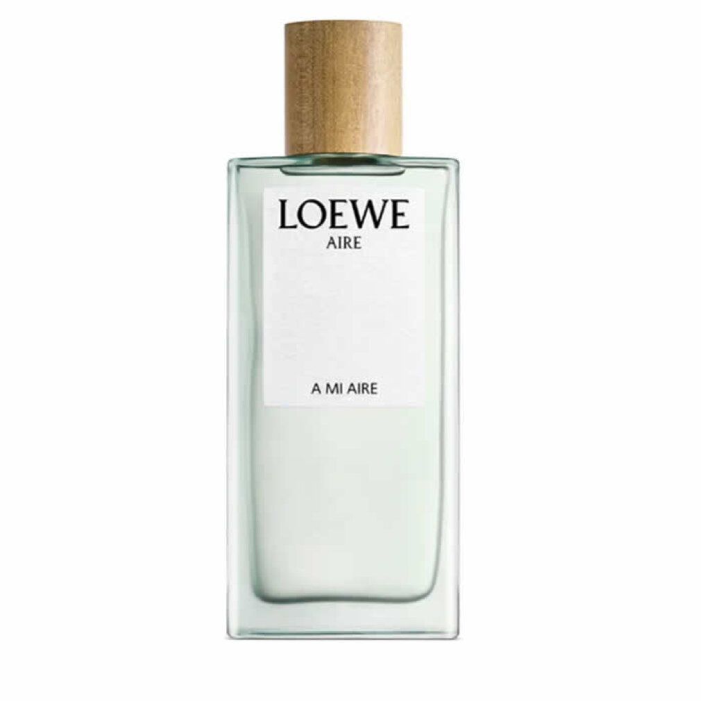 Rechteckiger Flakon mit Holzverschluss. Auf weißem Etikett: LOEWE AIRE, A MI AIRE. Hellgrüne Flüssigkeit.
