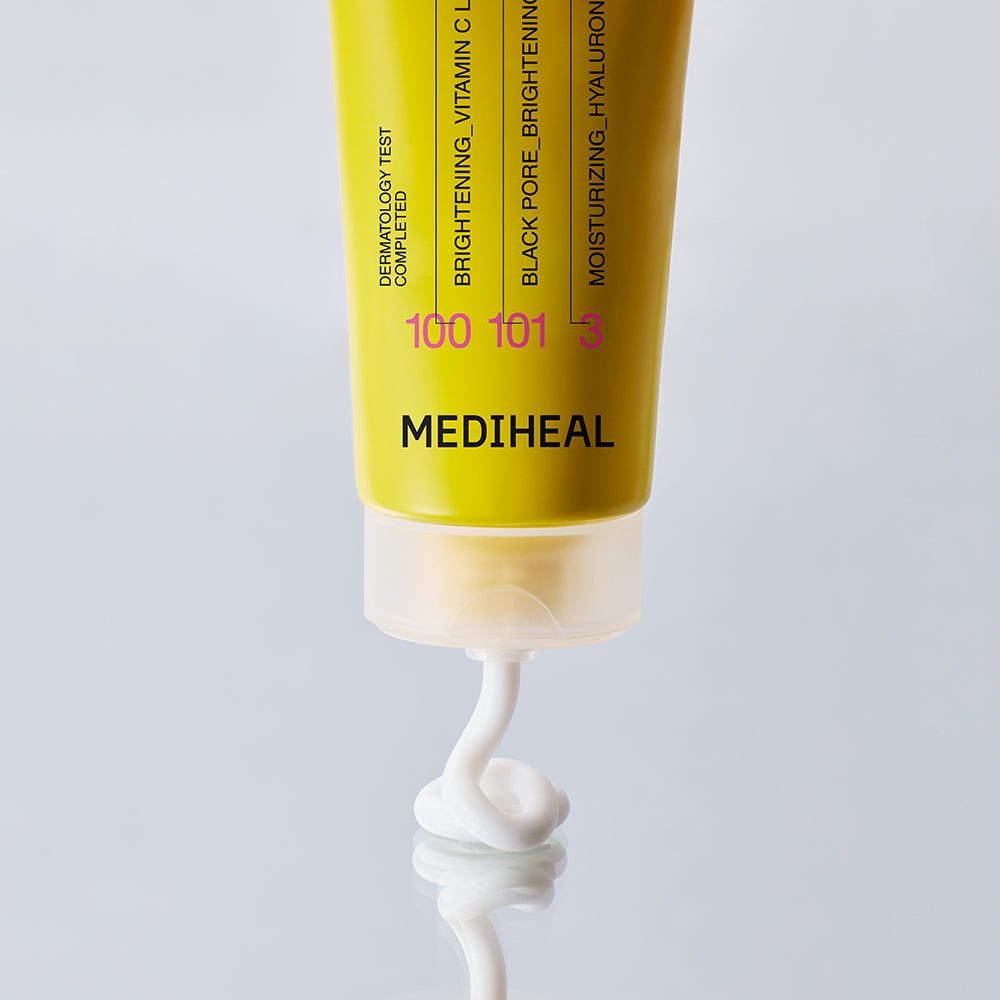 Tube mit weißem Produkt. Aufschrift: MEDIHEAL. Gelber Streifen mit Text. Produkt wird aus der Tube gedrückt.