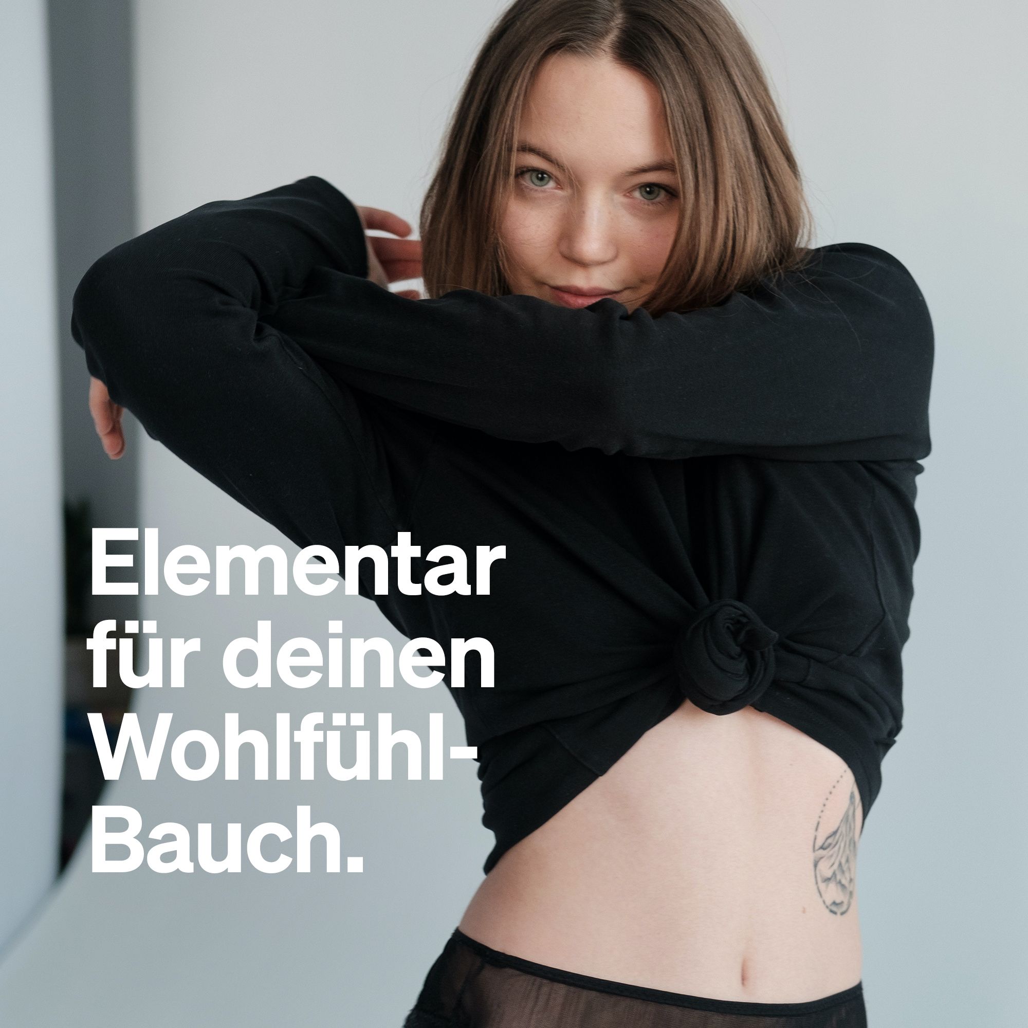 Junge Frau in schwarzem Oberteil. Text: "Elementar für deinen Wohlfühl-Bauch."