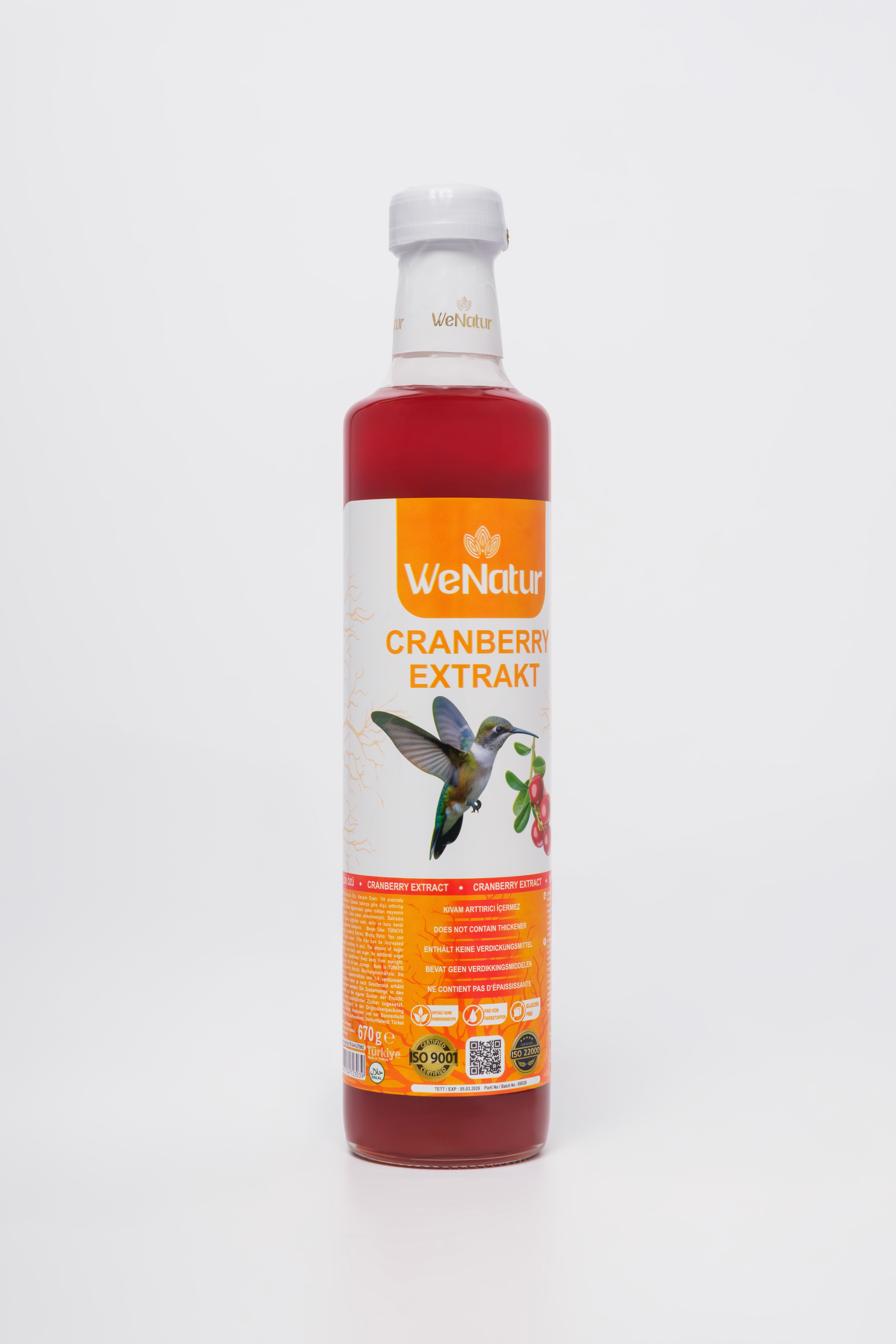 Flasche mit Cranberry-Extrakt, Etikett mit Kolibri und Beeren.