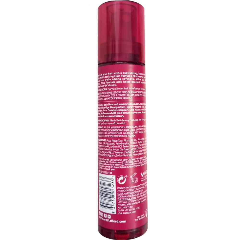Rote Sprühflasche mit Haarduft-Parfüm. Enthält Inhaltsstoffe und Anweisungen.
