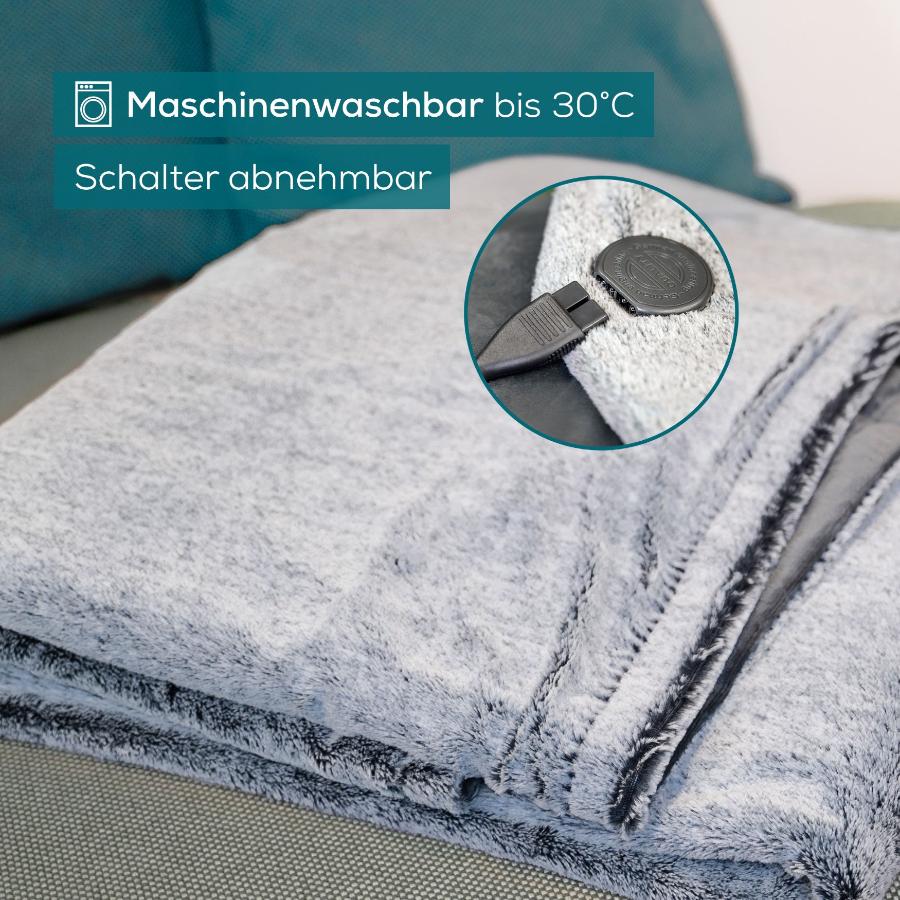 Graue Wärmezudecke mit abnehmbarem Schalter. Maschinenwaschbar bis 30°C.