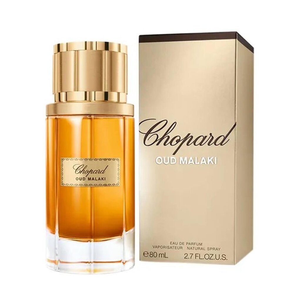 Parfümflakon und Verpackung. Aufschrift "Chopard Oud Malaki". Goldfarbene Verpackung, Flakon mit goldfarbener Flüssigkeit.