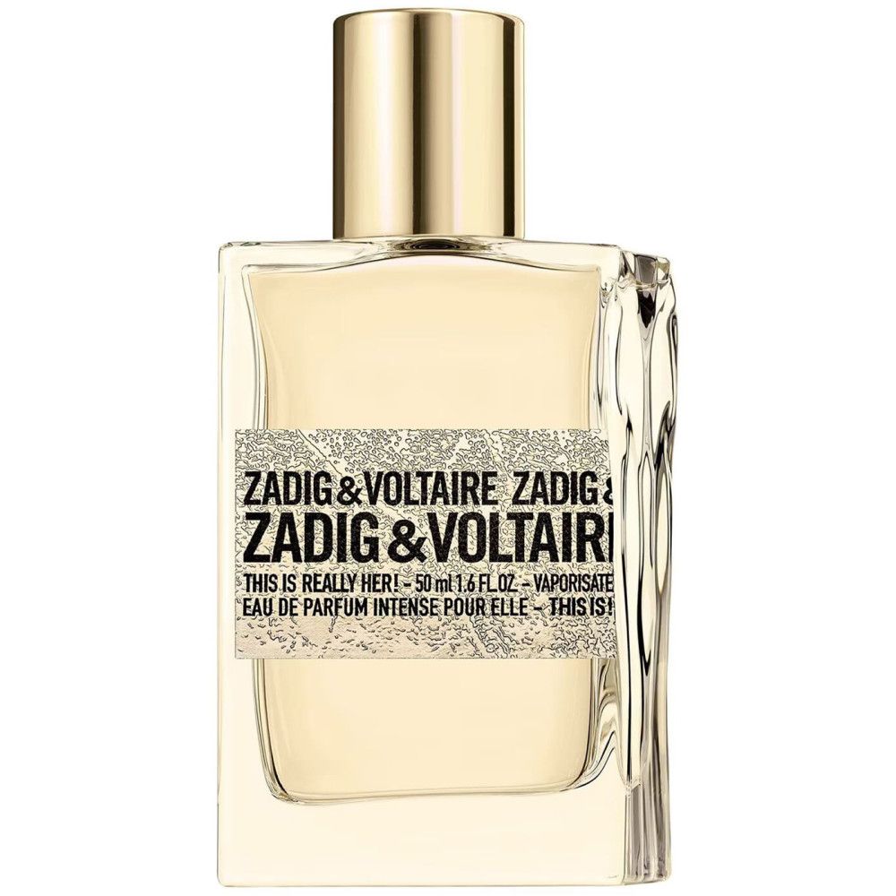 ZADIG & VOLTAIRE Eau de Parfum Flakon. Rechteckige Form, goldfarbener Verschluss. Aufschrift: THIS IS REALLY HER! und Markenname.