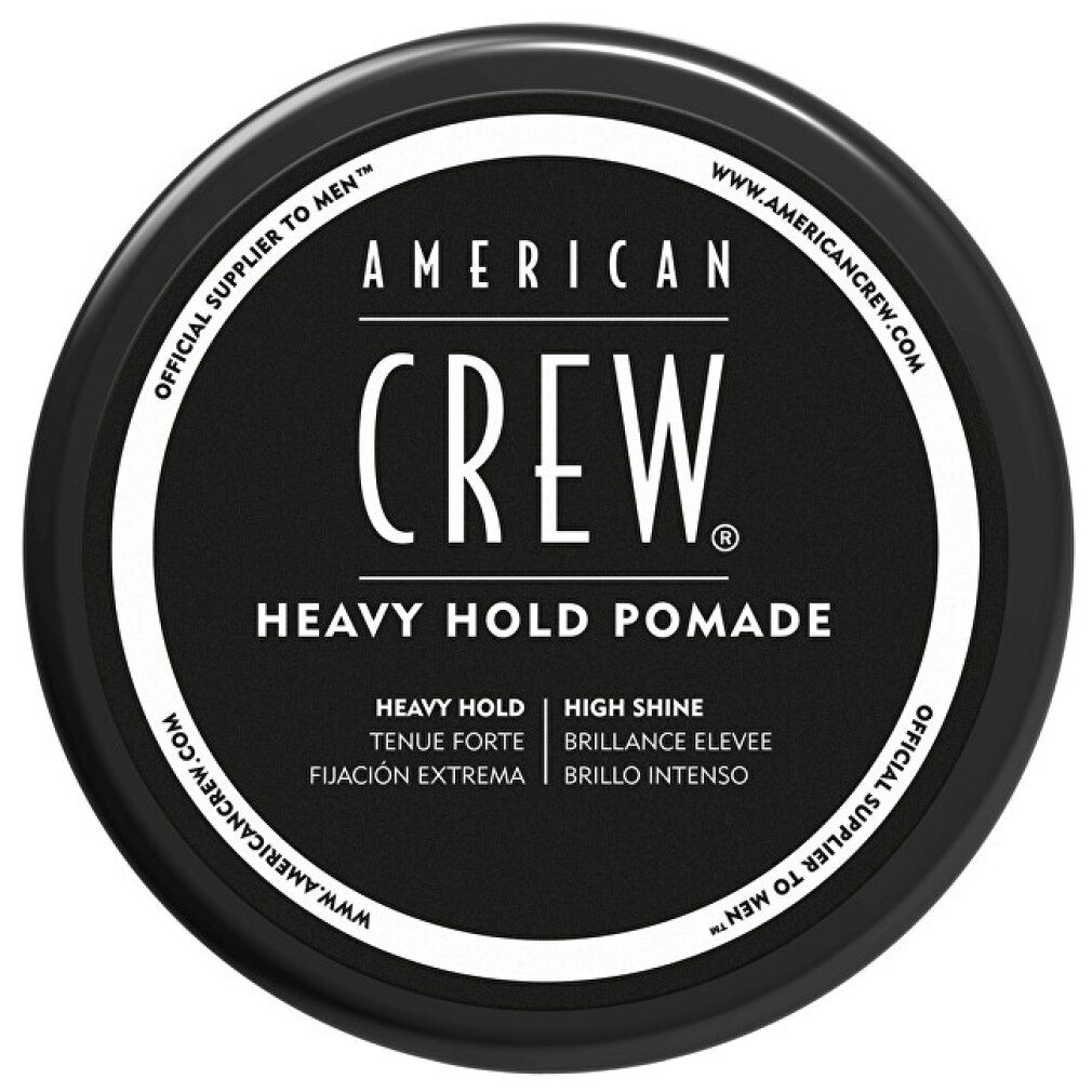 Schwarzer Deckel der American Crew Heavy Hold Pomade. Produktname und Details sind in Weiß geschrieben. Mit Text in Englisch, Spanisch und Französisch.