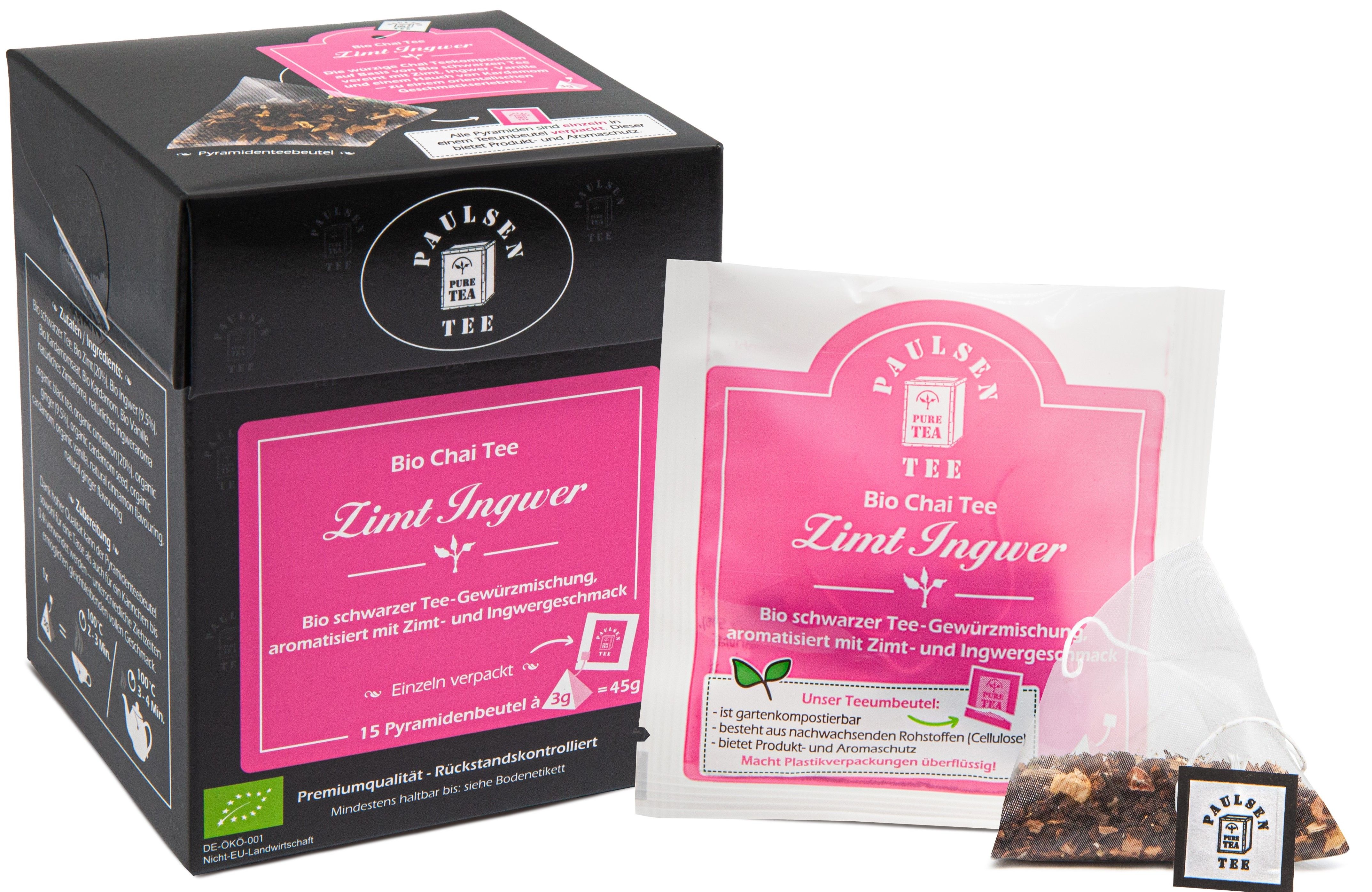 Schwarze Tee-Box mit rosa Etikett und einzelnem Teebeutel. Aufschrift: Bio Chai Tee Zimt Ingwer. Pyramidenbeutel.
