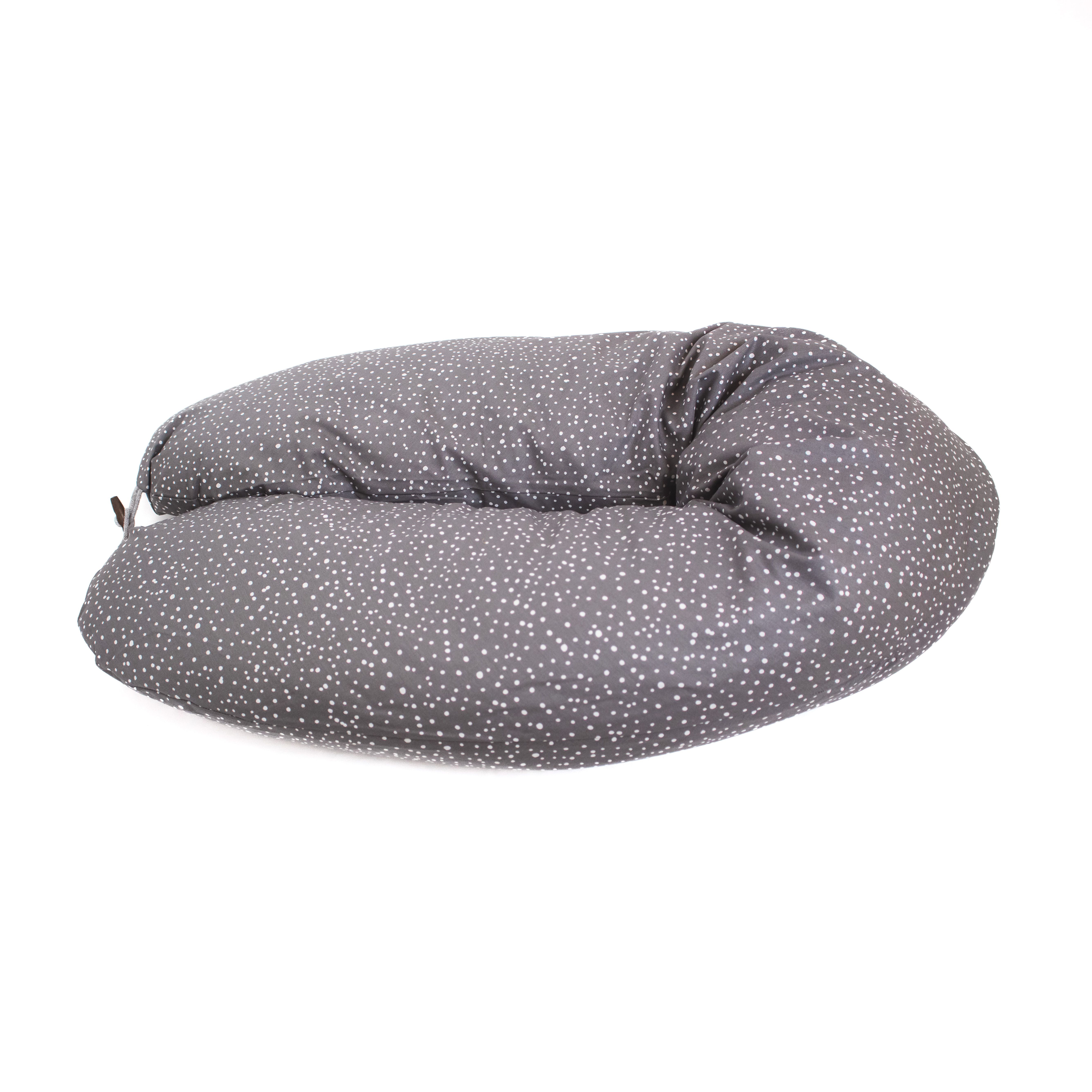 Graues Stillkissen mit weißen Punkten. Halbmondform, Stoffbezug.