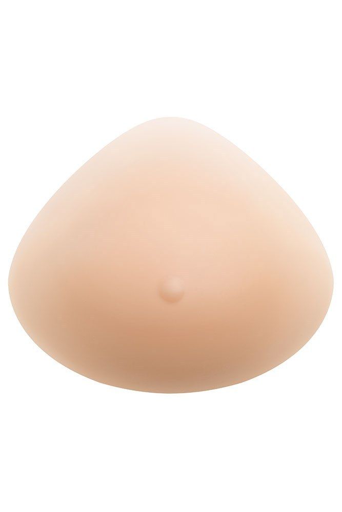 Hautfarbene, tropfenförmige Brustprothese. Mit einer kleinen Erhebung in der Mitte.