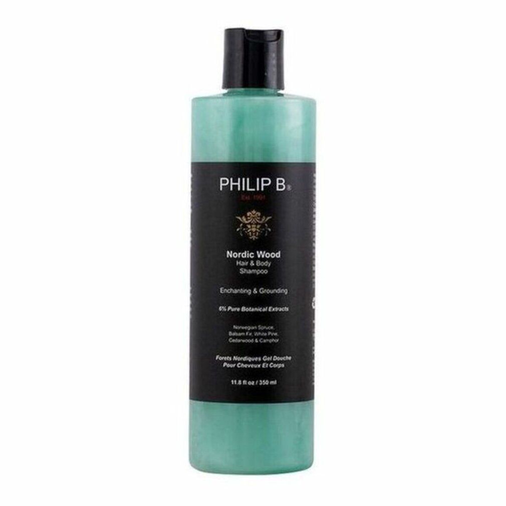Flasche mit schwarzem Deckel. Aufschrift: PHILIP B. Nordic Wood Hair + Body Shampoo. Grünliche Flüssigkeit sichtbar. 350 ml.