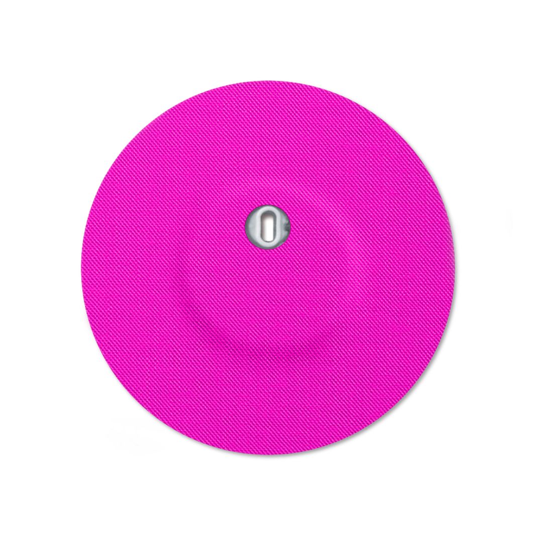 Rundes, pinkfarbenes Pflaster mit Belüftungsloch und diagonaler Struktur.
