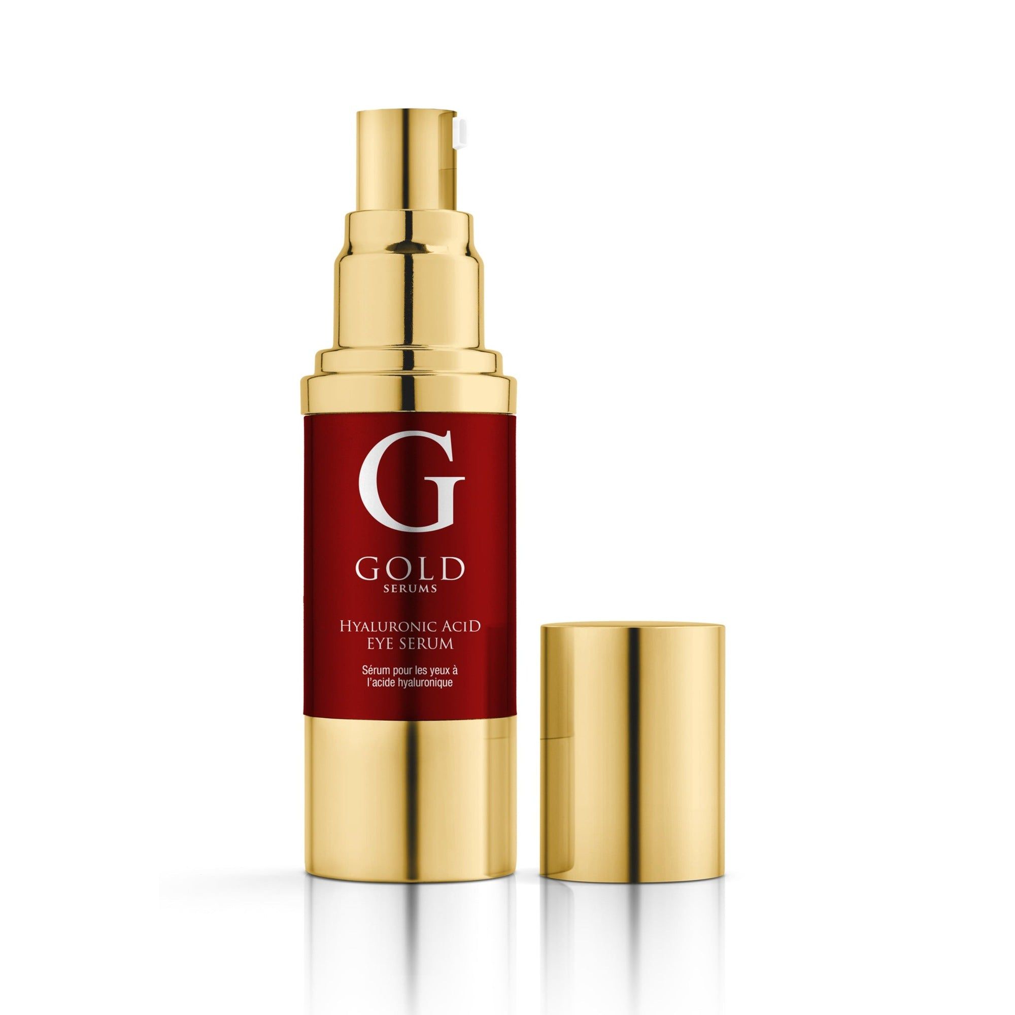 Kosmetikflasche mit goldener Kappe und rotem Etikett. Aufschrift: Gold Serums. Produkt: Augenserum. Kappe daneben.