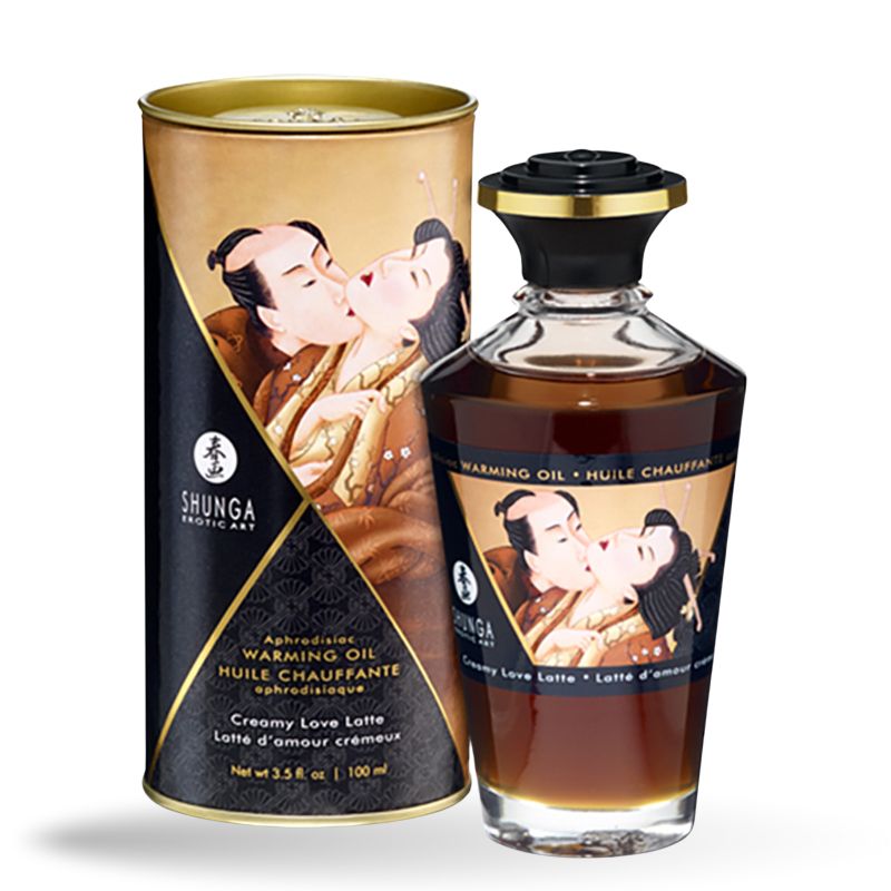 Glasflasche und zylindrische Verpackung. Aufschrift: SHUNGA, Warming Oil, Creamy Love Latte. Abbildung: küssendes Paar.