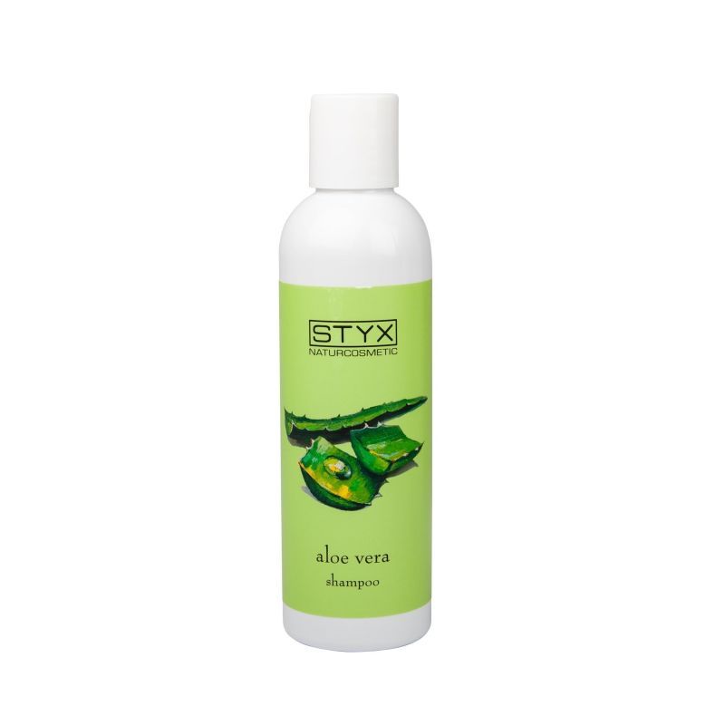 Weiße Flasche mit grünem Etikett. Aufschrift STYX Naturcosmetic und Aloe Vera. Abbildung von Aloe Vera Blättern.