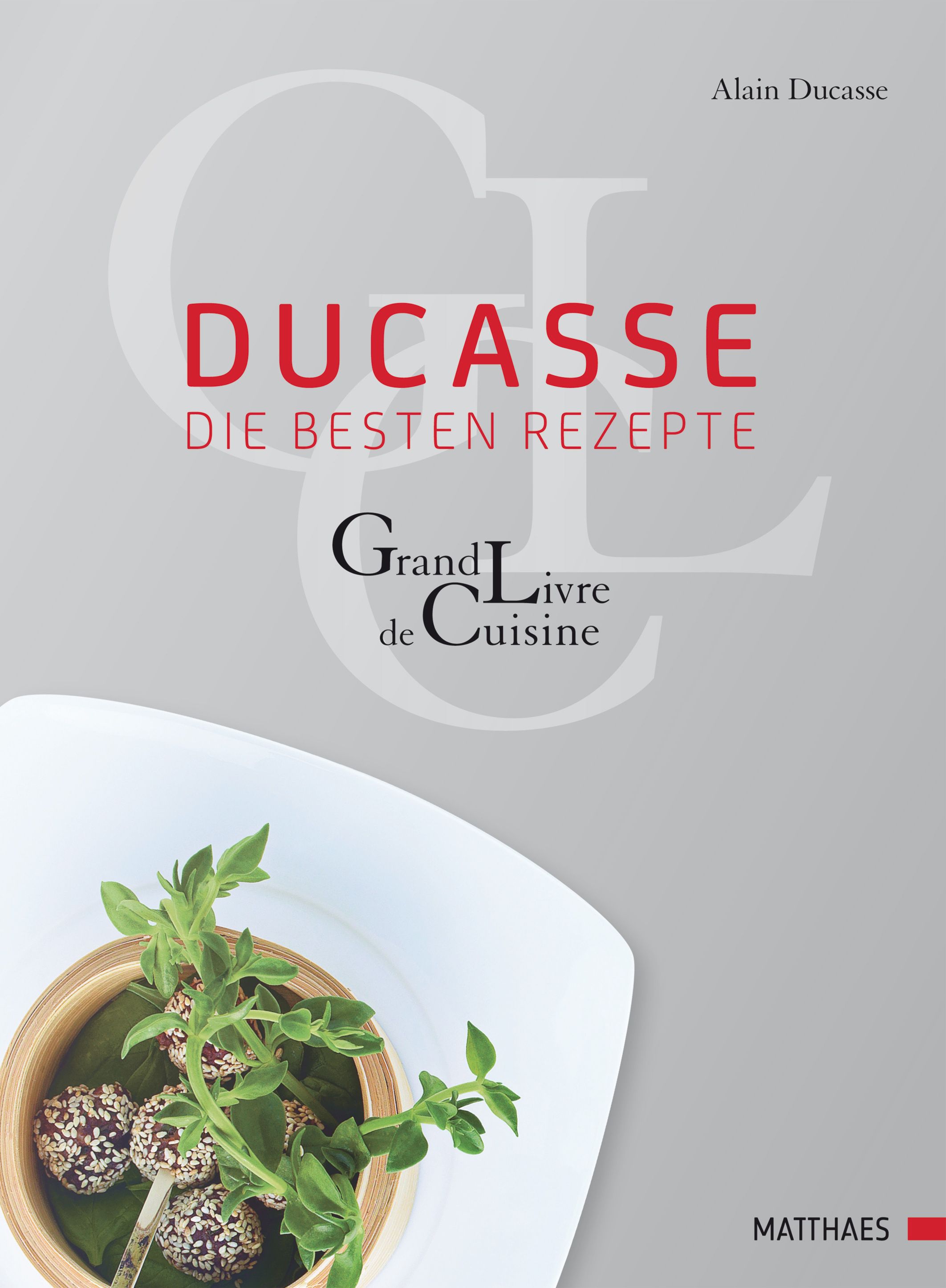 Buchcover mit Titel "Ducasse - die besten Rezepte". Autor: Alain Ducasse. Auf weißem Teller mit Essen.