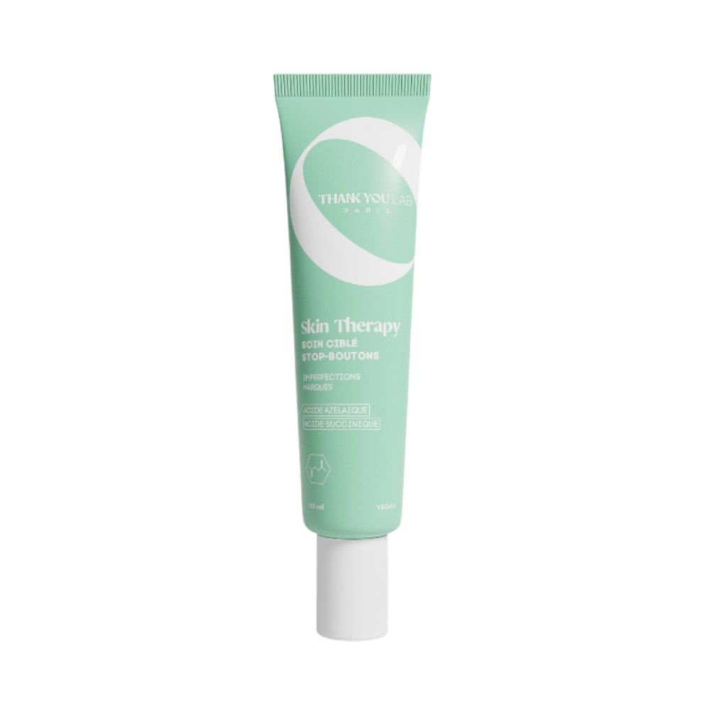 Grüne Tube, weißer Verschluss. Text: THANK YOU LAB, Skin Therapy, SOIN CIBLE STOP-BOUTONS.