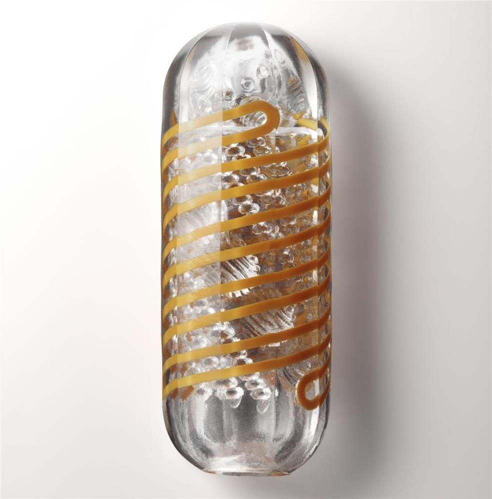 TENGA Spinner Beads 05: Transparenter Behälter mit orangefarbenen Spiralen und inneren Perlen.