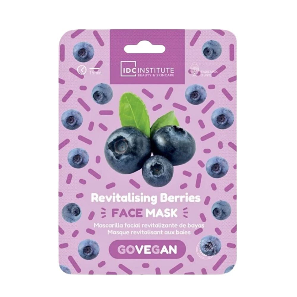 Gesichtsmaske mit Blaubeeren und Blättern auf lilafarbenem Hintergrund. Verpackung mit Produktnamen und Logo.