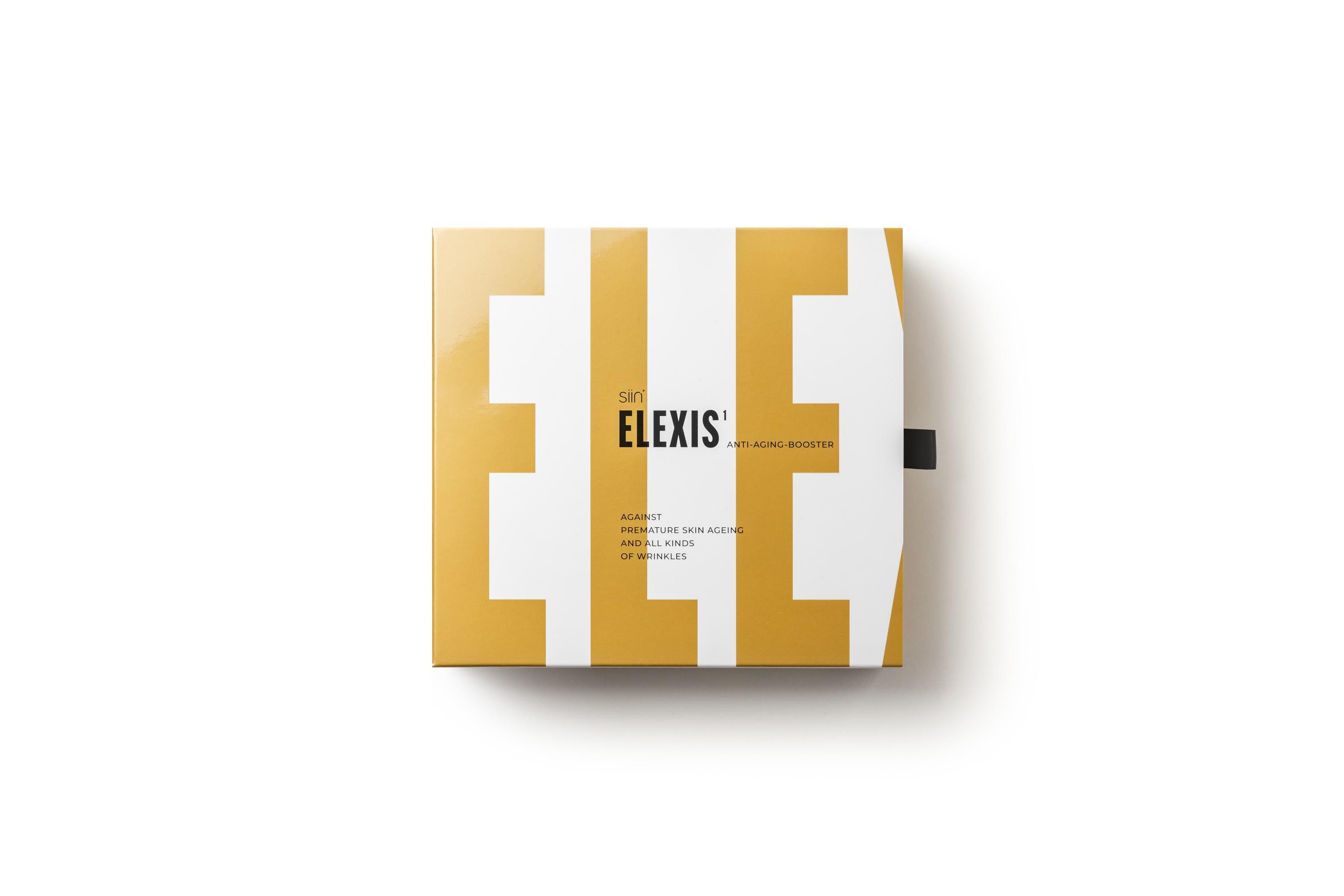 Verpackung mit gelbem und weißem Design. Aufschrift: ELEXIS. Schwarzer Bandverschluss.